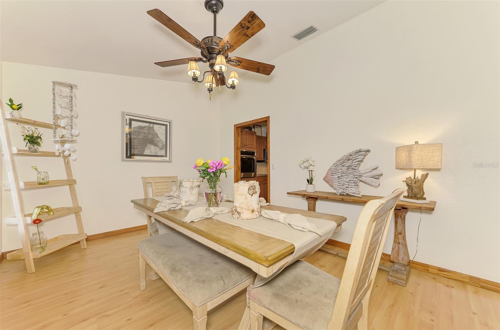 Formal dining room with easy access to the kitchen - 4610 403RD ST E, MYAKKA CITY