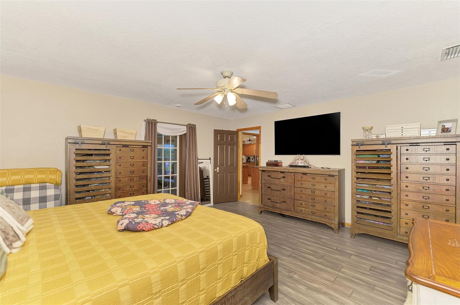 French door leads to the screened lanai - 4610 403RD ST E, MYAKKA CITY