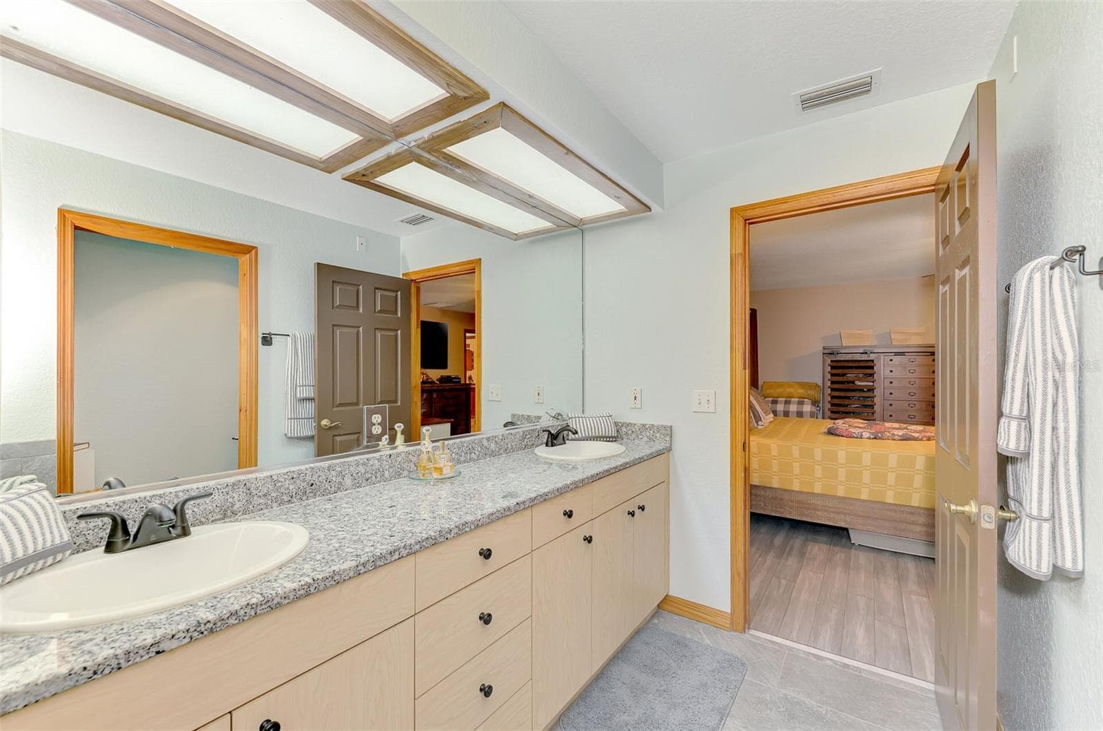 Primary bathroom with oversized cast iron soaker tub, separate shower and water closet - 4610 403RD ST E, MYAKKA CITY