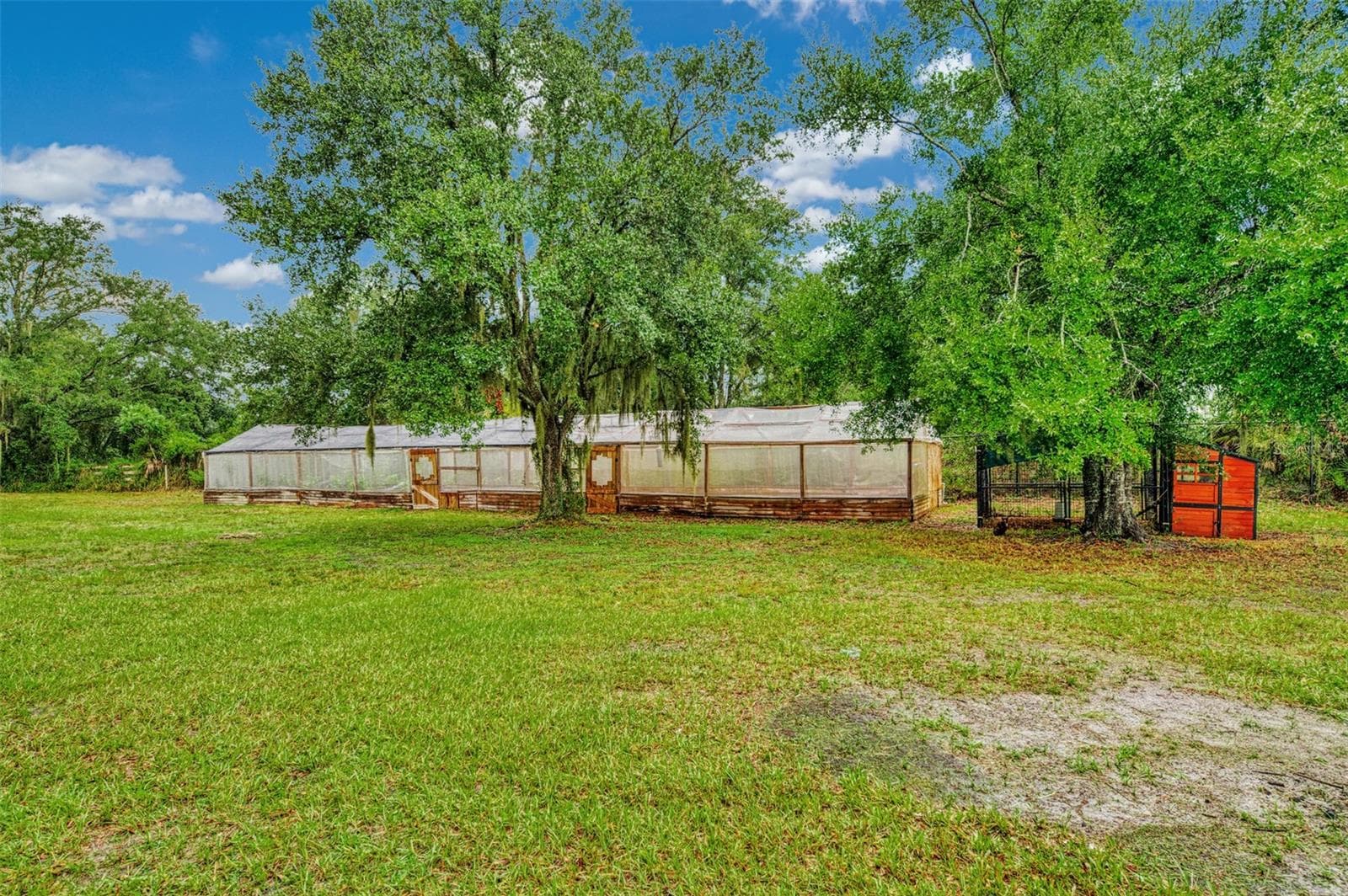 Greenhouse and several chicken coops - 4610 403RD ST E, MYAKKA CITY