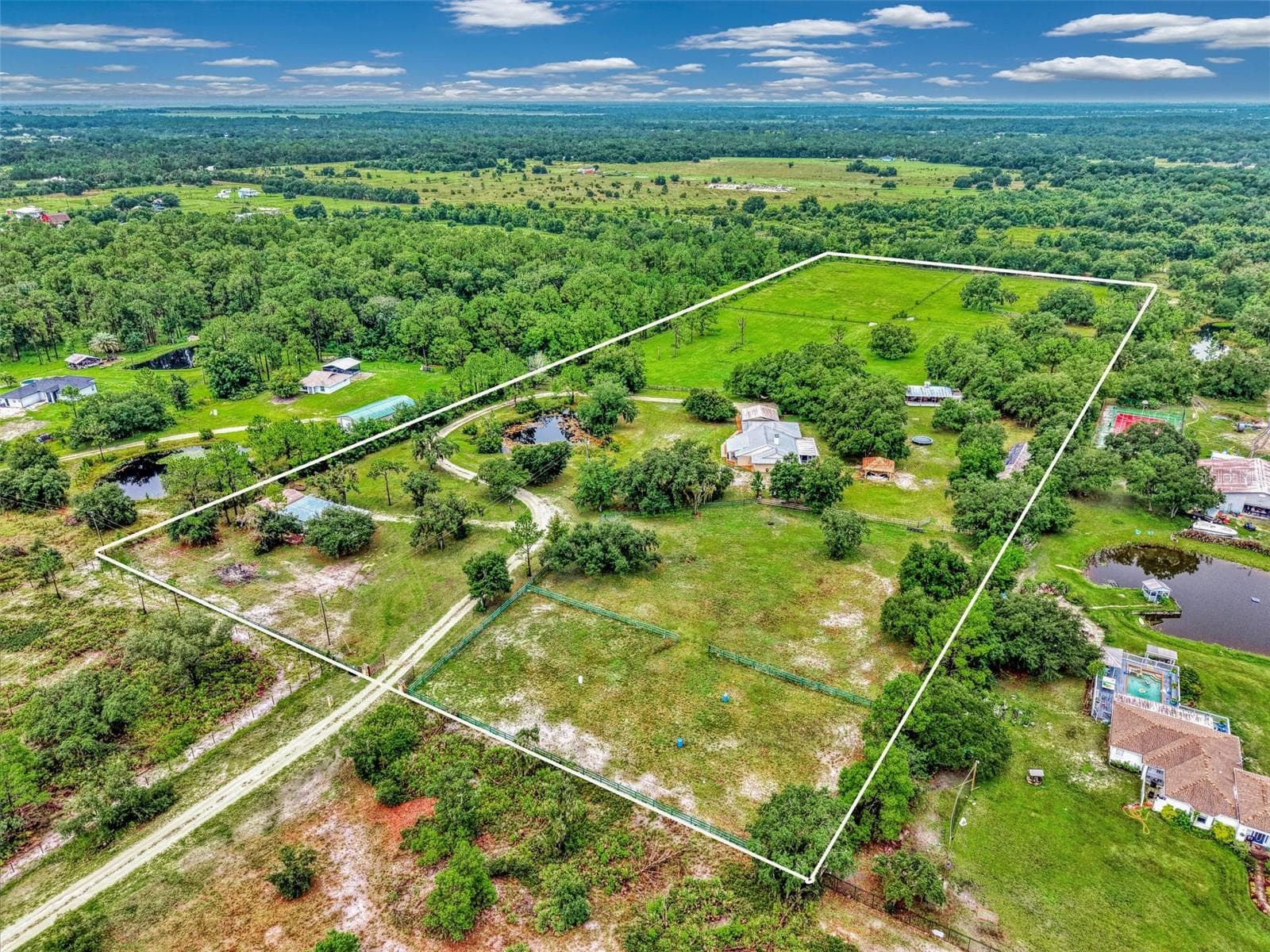 Long private driveway to the property, come through the gate and the shop is on the left side - 4610 403RD ST E, MYAKKA CITY