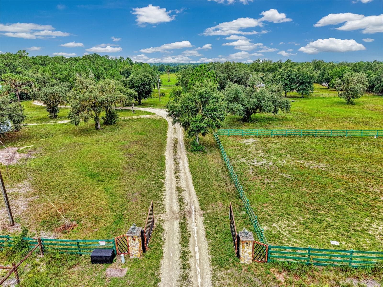 100x200 grass riding arena on the right and an exercise paddock behind it - 4610 403RD ST E, MYAKKA CITY