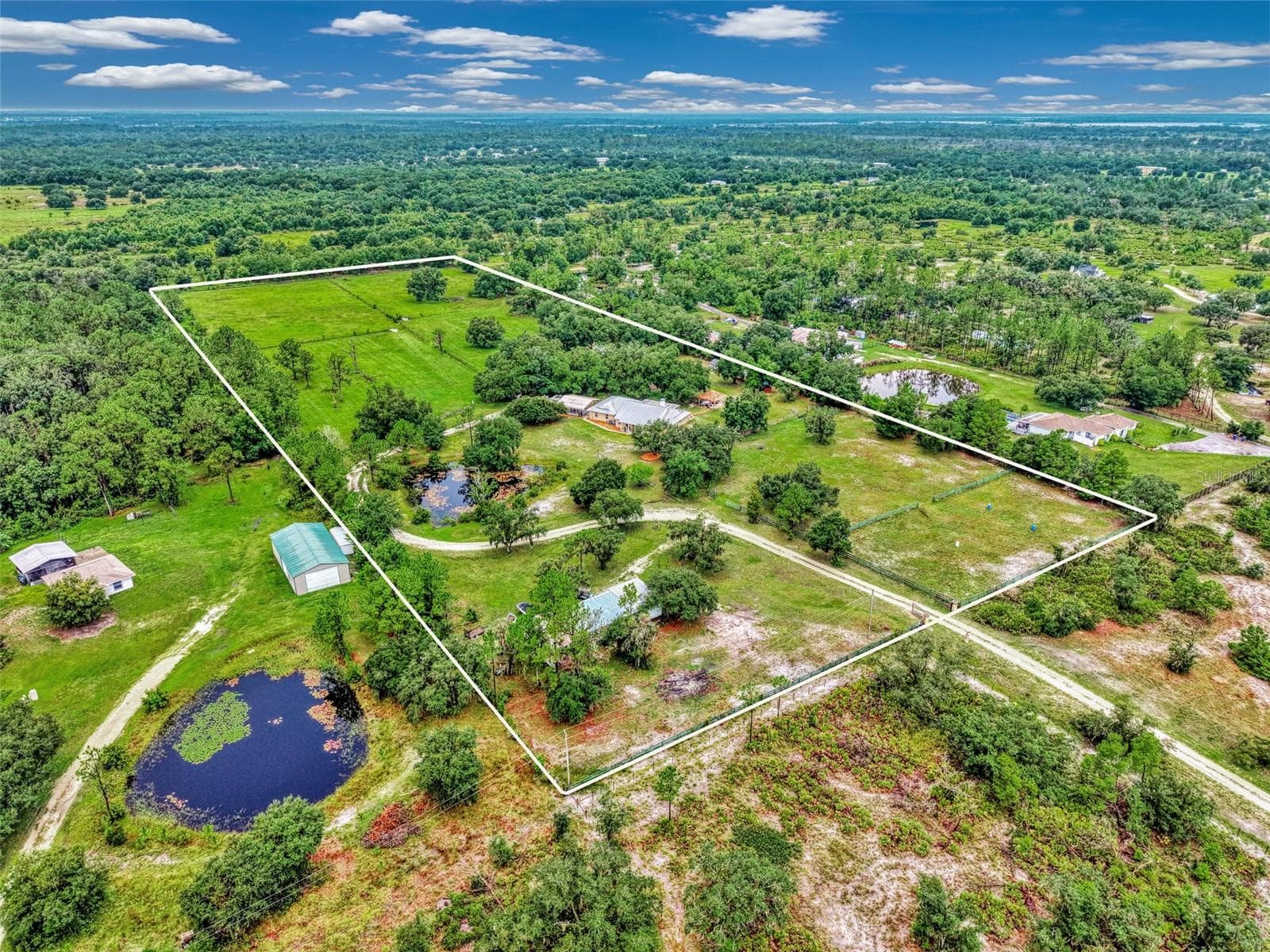 Shop is on the left side and riding arena on the right side - 4610 403RD ST E, MYAKKA CITY