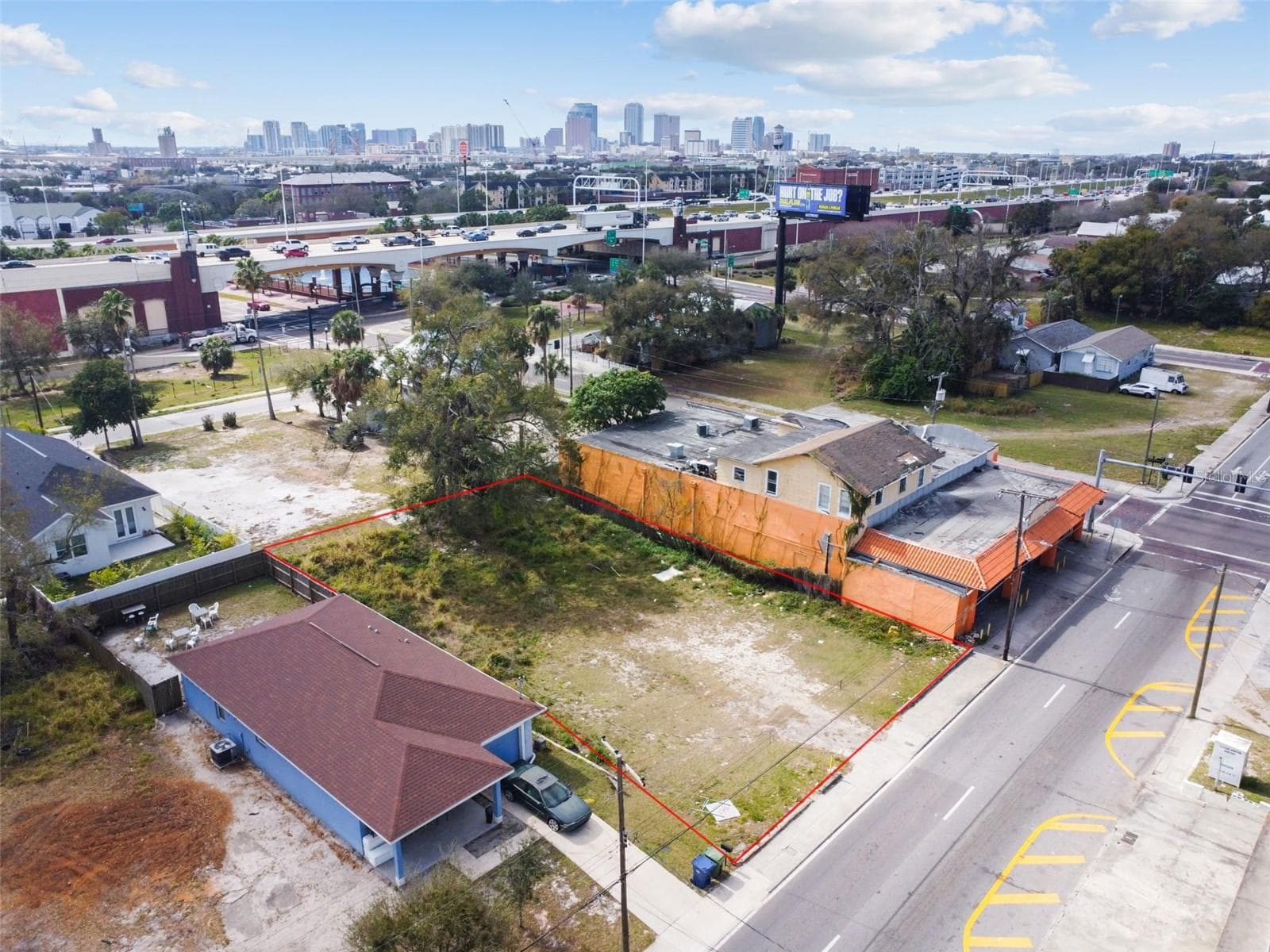 New Townhomes under construction left of blue home - 2213 E COLUMBUS DR, TAMPA