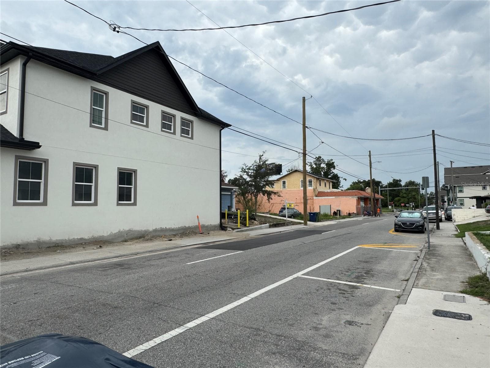 New townhomes under construction two lots down. - 2213 E COLUMBUS DR, TAMPA