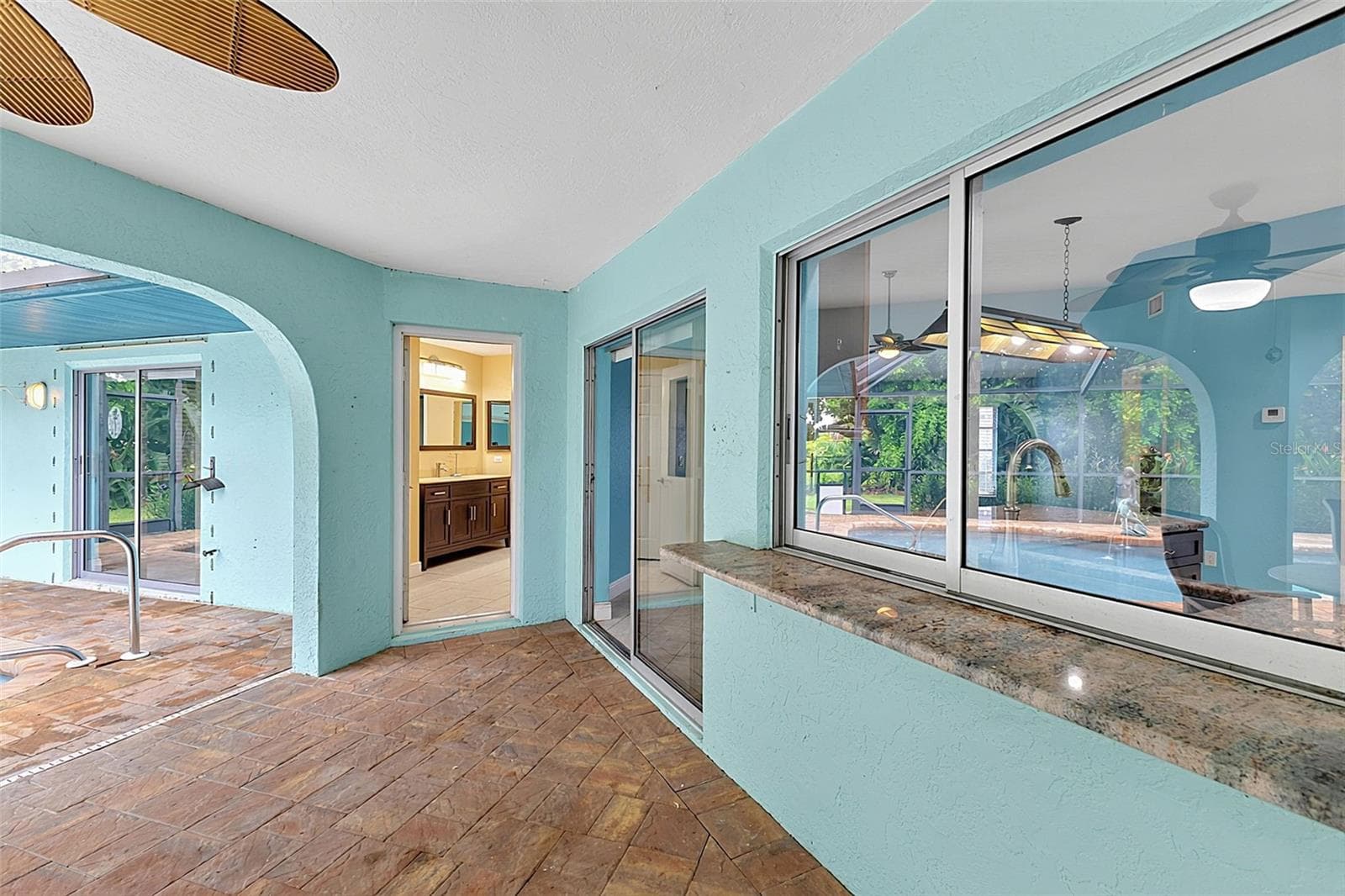 Covered lanai to family room sliders and pool bath - 339 BARCELONA ST, PUNTA GORDA