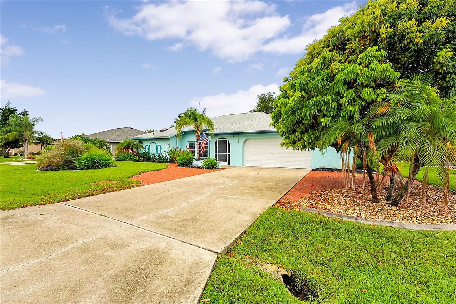 Lychee tree and front of home - 339 BARCELONA ST, PUNTA GORDA