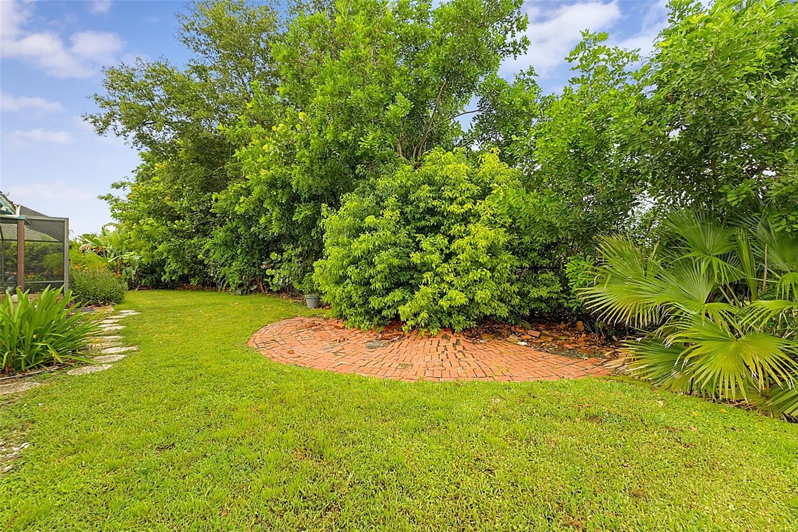 Rear of yard tree lined - 339 BARCELONA ST, PUNTA GORDA