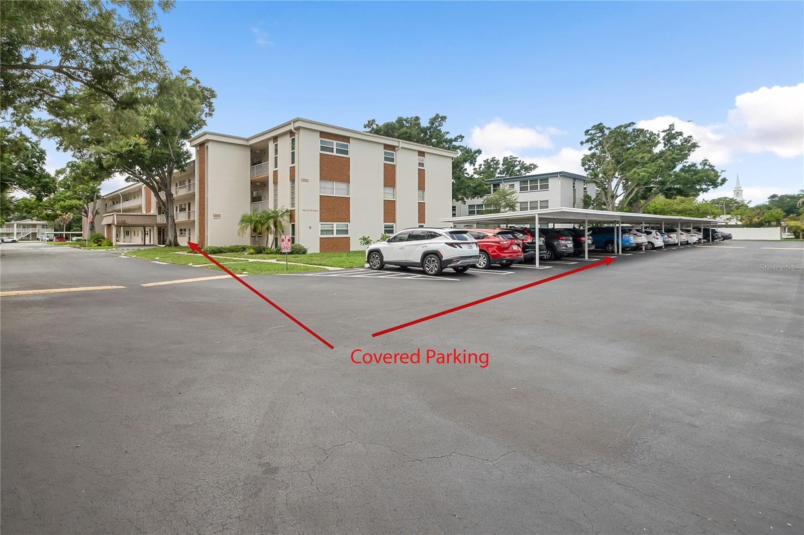 Carport in relation to front door - 5880 38TH AVE N #109, ST PETERSBURG