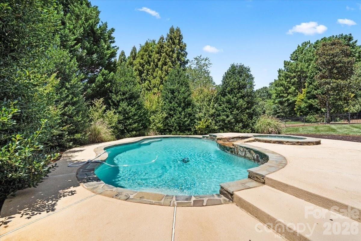 Cool off in this heated, salt water inground pool and spa - 109 Pauls Lane, Mooresville