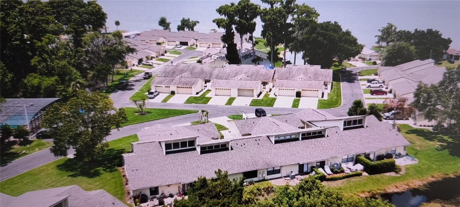 Community pool (left side of photo) - 2214 CYPRESS COVE DR #4, TAVARES