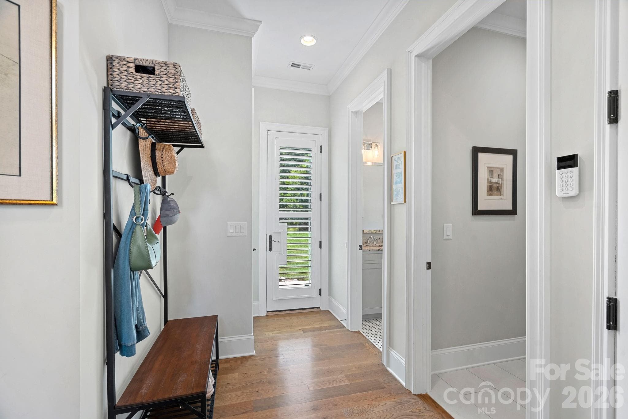 Hallway from garage leading to outside door (or pool if added), powder room and laundry room. - 2889 Mount Pleasant Road, Sherrills Ford