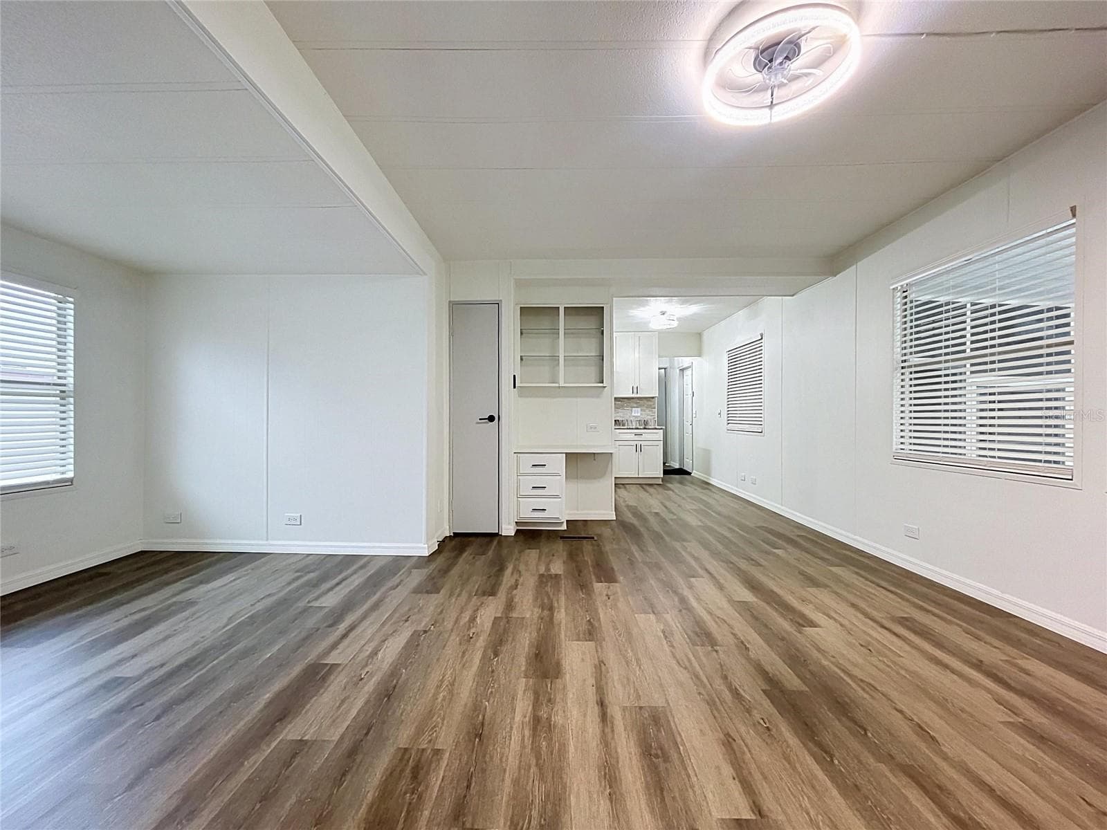 Living Rm, Dining Rm Combo with built in desk and open shelves - 6965 FORT KING RD, ZEPHYRHILLS
