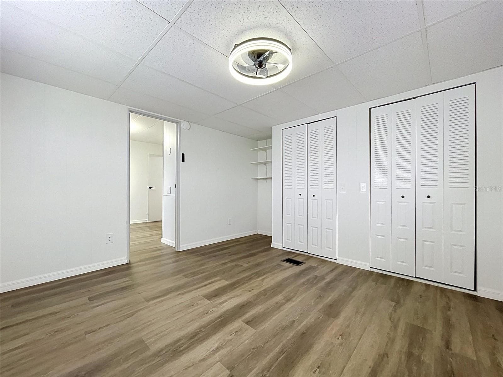 Bedroom 1 with double closets and shelving - 6965 FORT KING RD, ZEPHYRHILLS