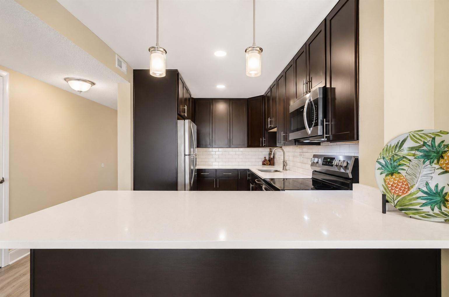 Kitchen, with breakfast bar. - 51 ISLAND WAY #311, CLEARWATER BEACH