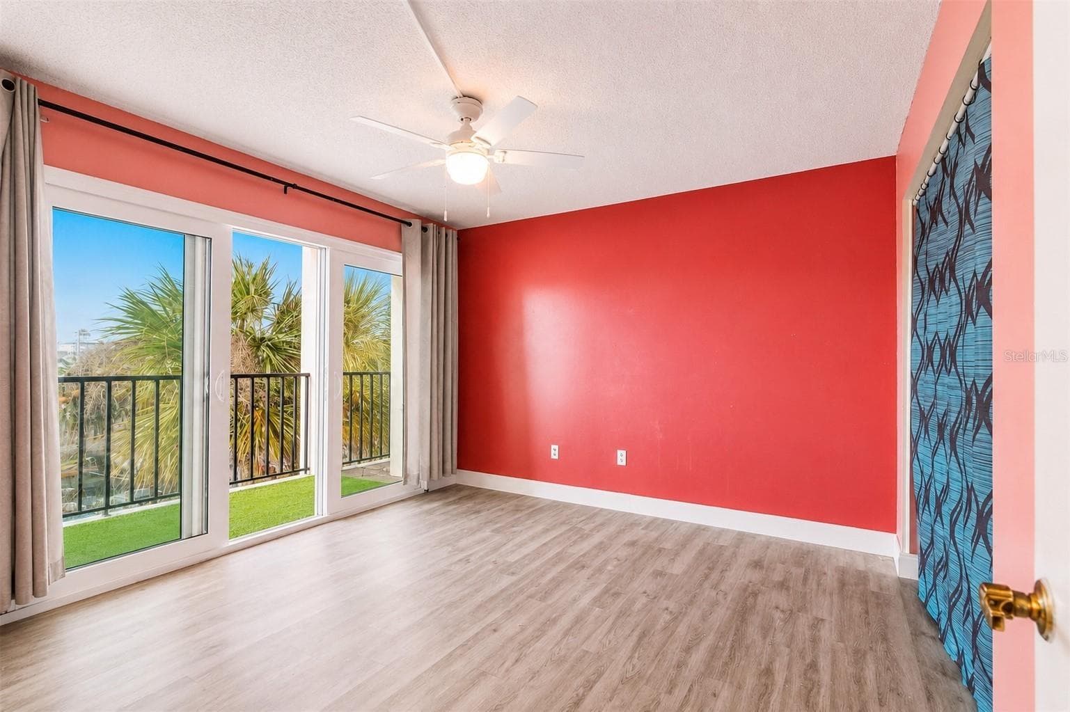 Guest bedroom with private balcony and closet. - 51 ISLAND WAY #311, CLEARWATER BEACH