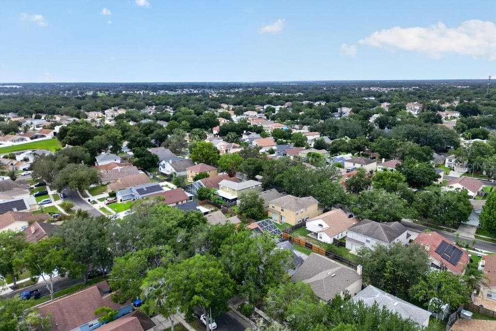 Aerial view showcasing the neighborhood's mature tree canopy. - 97 ABBEY HOLLOW DR, APOPKA
