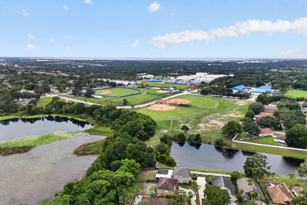 Aerial view showcasing the nearby Northwest Recreation Complex and surrounding recreational amenities. - 97 ABBEY HOLLOW DR, APOPKA