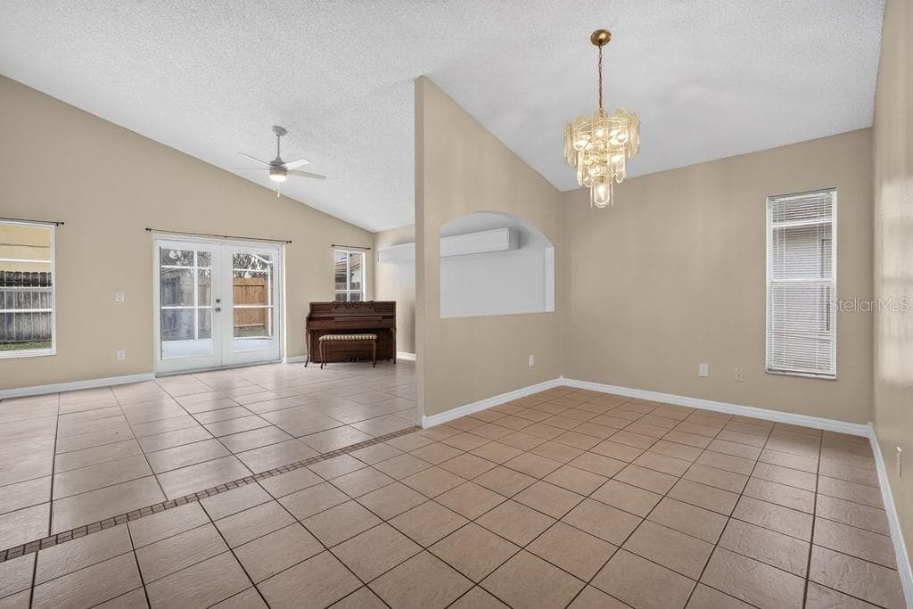 Formal dining area open to the main living space. - 97 ABBEY HOLLOW DR, APOPKA