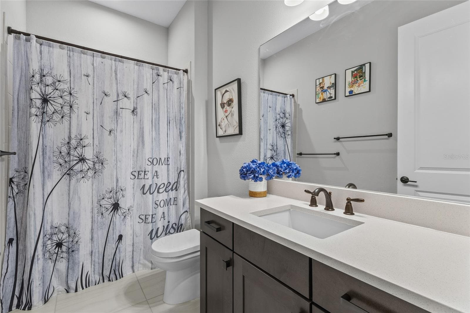 guest bathroom near front bedroom - 10342 MORNING MIST LN, SARASOTA