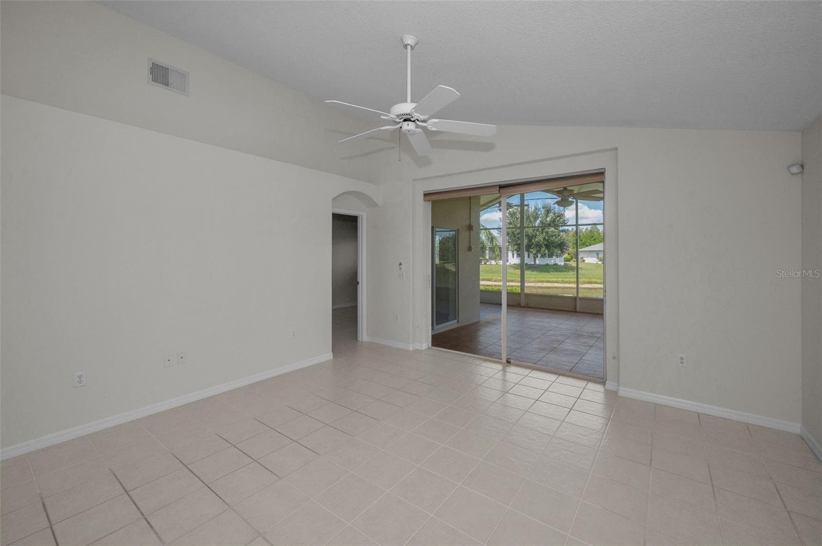 FAMILY ROOM WITH SLIDERS TO EXTENDED SCREEN ENCLOSED LANAI. - 12021 FERN TERRACE CT, TRINITY