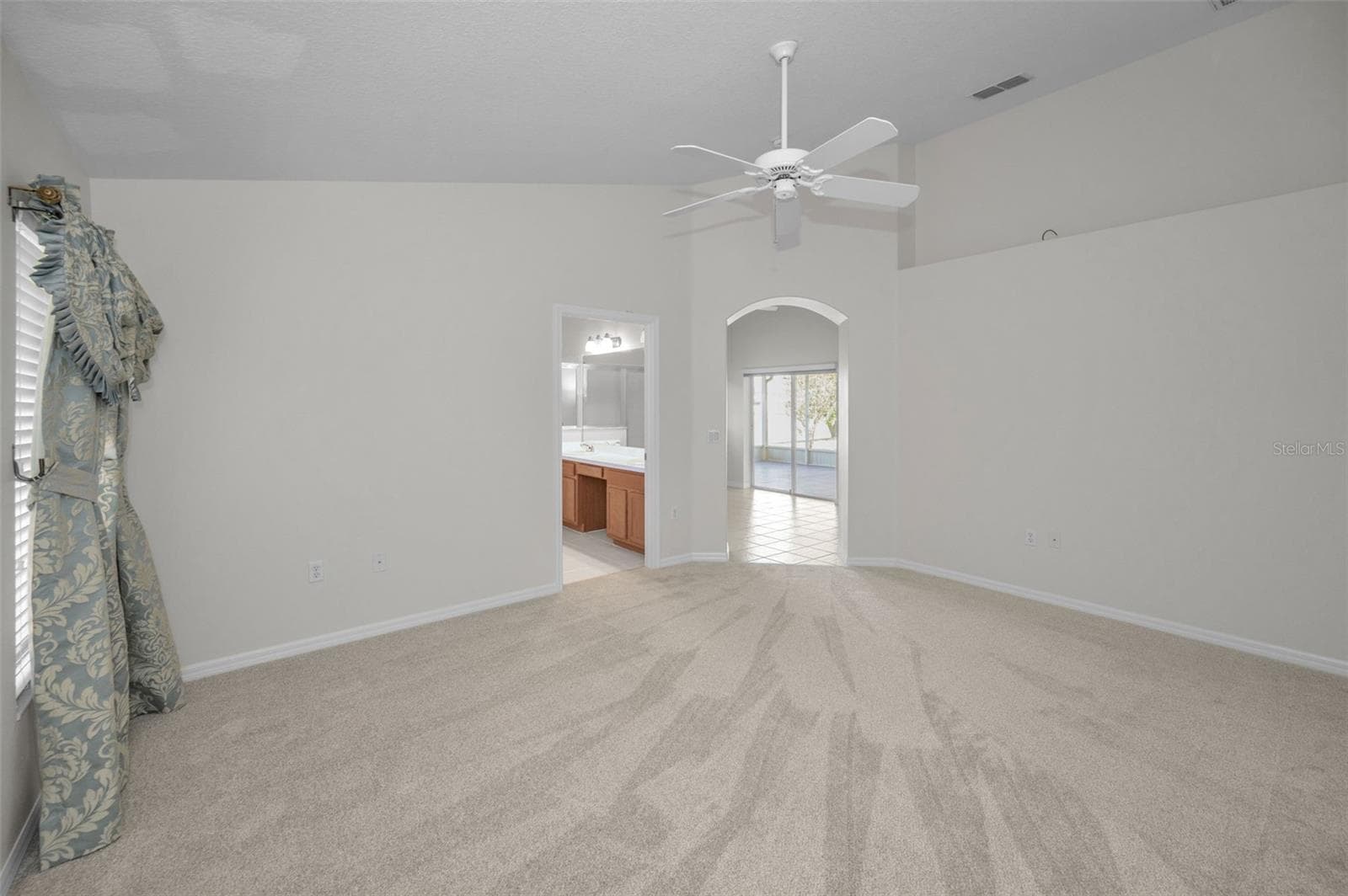 ANOTHER VIEW OF PRIMARY BEDROOM WITH ENTRANCE TO PRIMARY BATHROOM AND ADJACENT DEN/OFFICE. - 12021 FERN TERRACE CT, TRINITY
