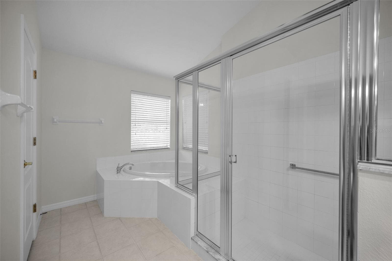 PRIMARY BATHROOM WITH WALK IN SHOWER AND GARDEN TUB - 12021 FERN TERRACE CT, TRINITY