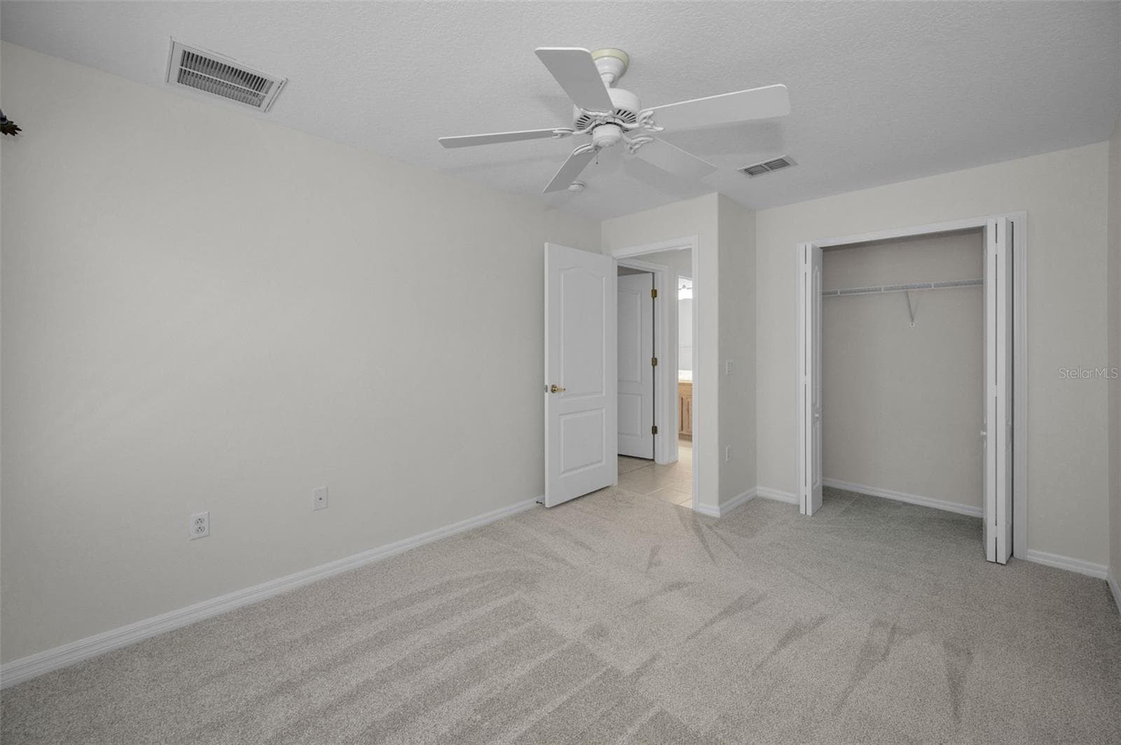 VIEW OF BEDROOM 2 AND CLOSET - 12021 FERN TERRACE CT, TRINITY