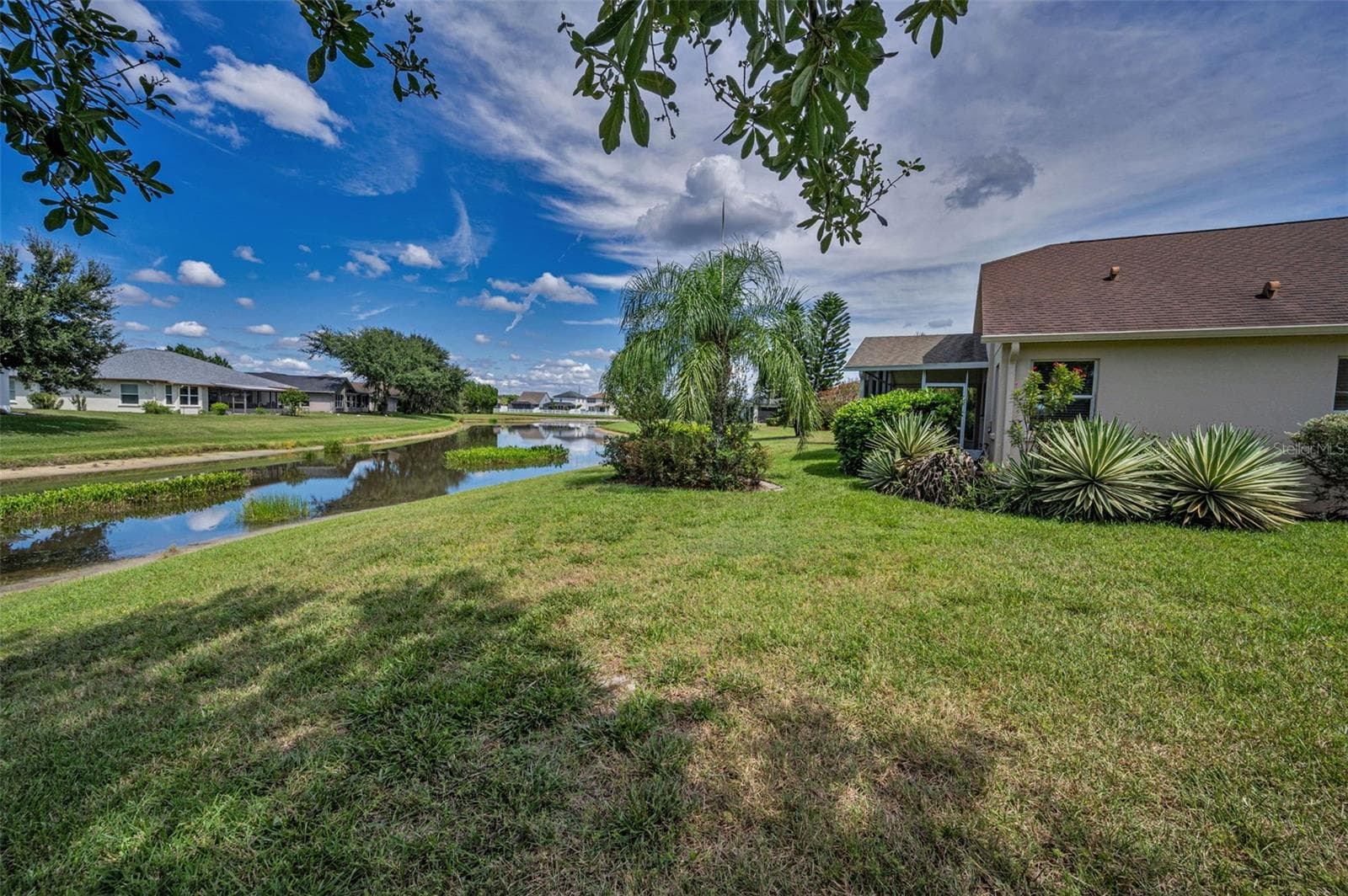SIDE VIEW OF HOME AAND LOT. - 12021 FERN TERRACE CT, TRINITY
