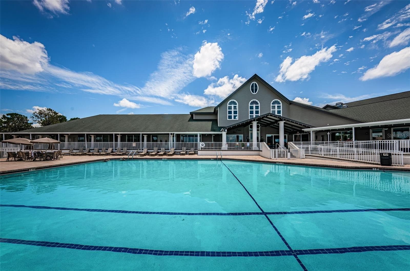 VIEW OF REAR CLUBHOUSE FROM POOL - 12021 FERN TERRACE CT, TRINITY