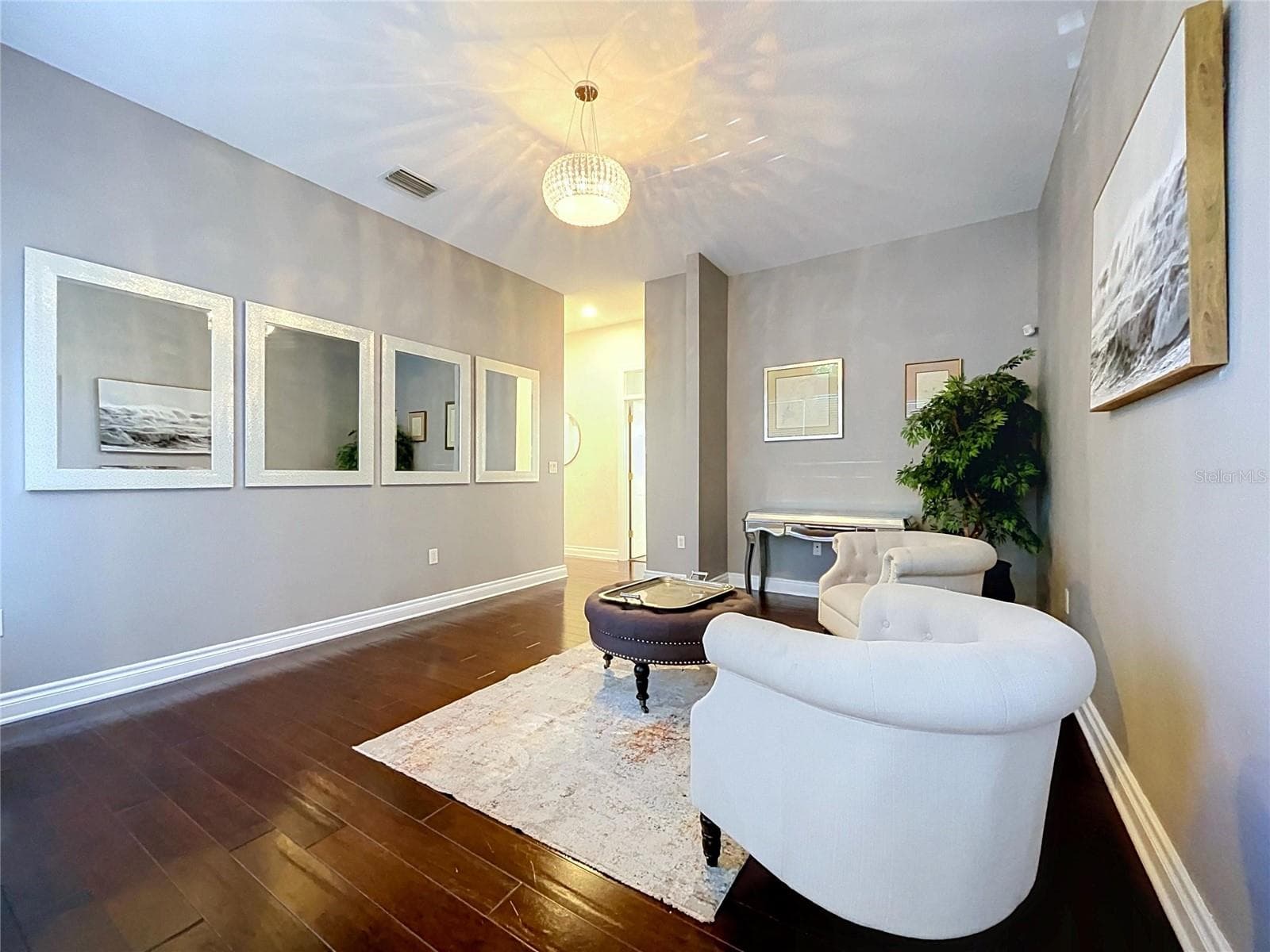 Sitting room before bedrooms 5/6/7 Downstairs - 2918 MAGNOLIA TRCE, TARPON SPRINGS