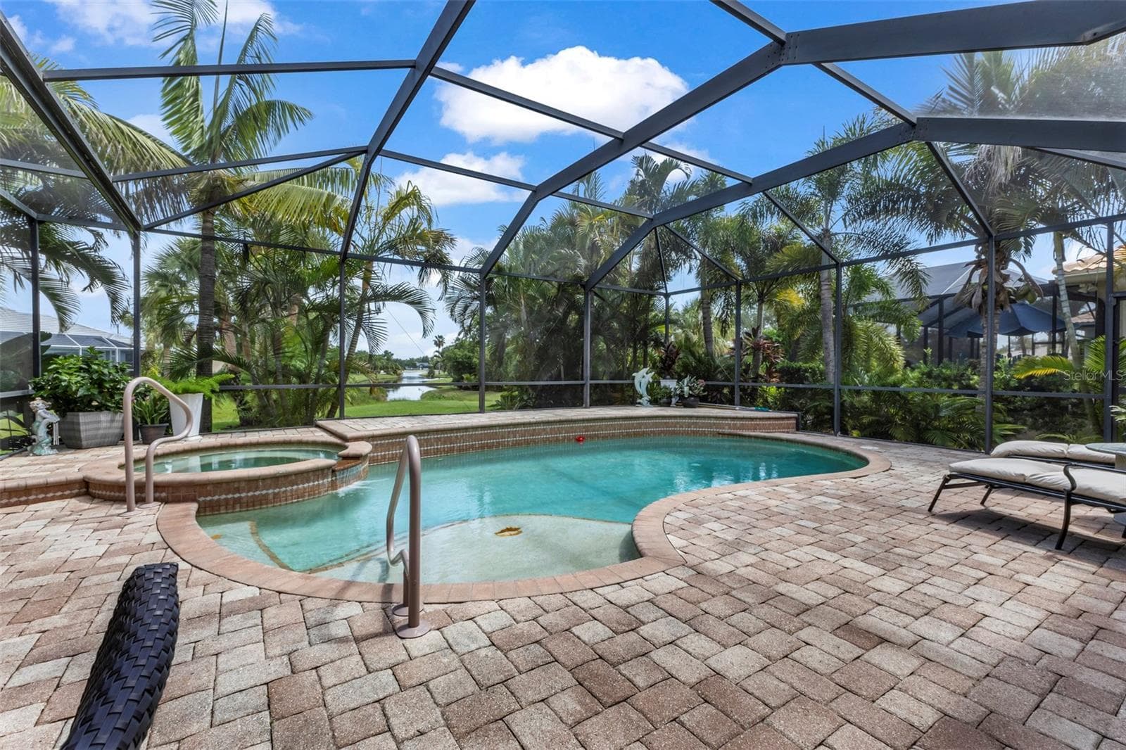 View of the lake as seen from the Pool - 24228 PEPPERCORN RD, PUNTA GORDA