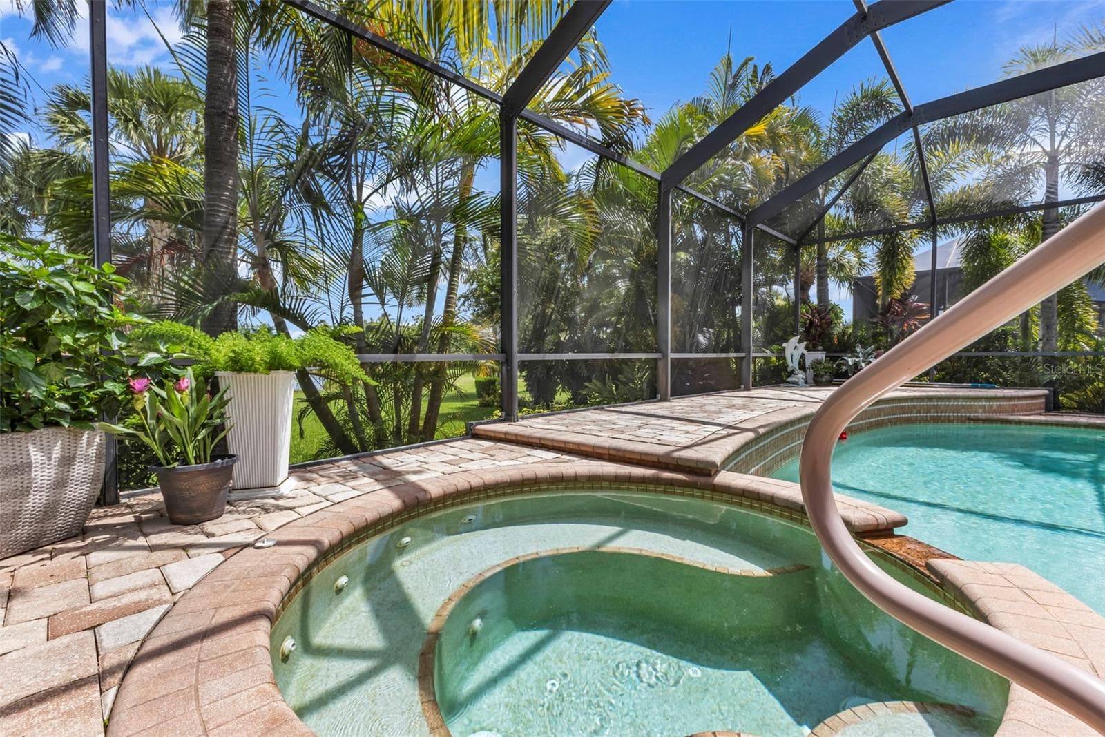 A private tropical retreat with a heated spa, sparkling pool and lush landscaping - 24228 PEPPERCORN RD, PUNTA GORDA