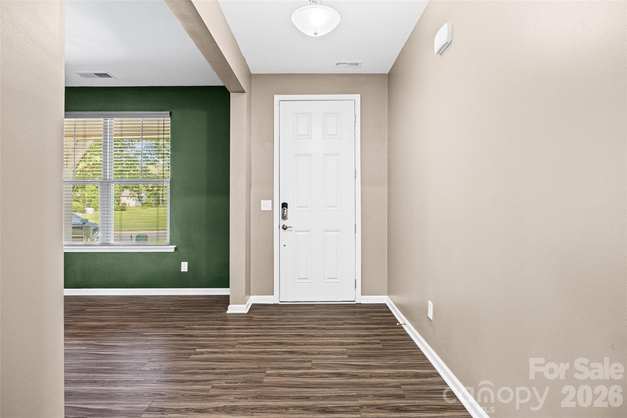 Entry options with a keypad-equipped front door or private interior access directly from the garage. - 596 Rustlewood Way, Rock Hill