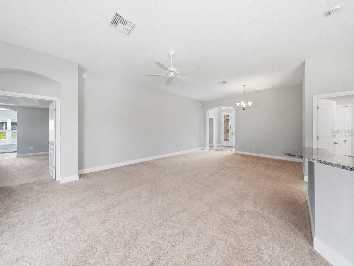 virtually staged - LR to front entry and dining - 1166 BLOUNT AVE, THE VILLAGES