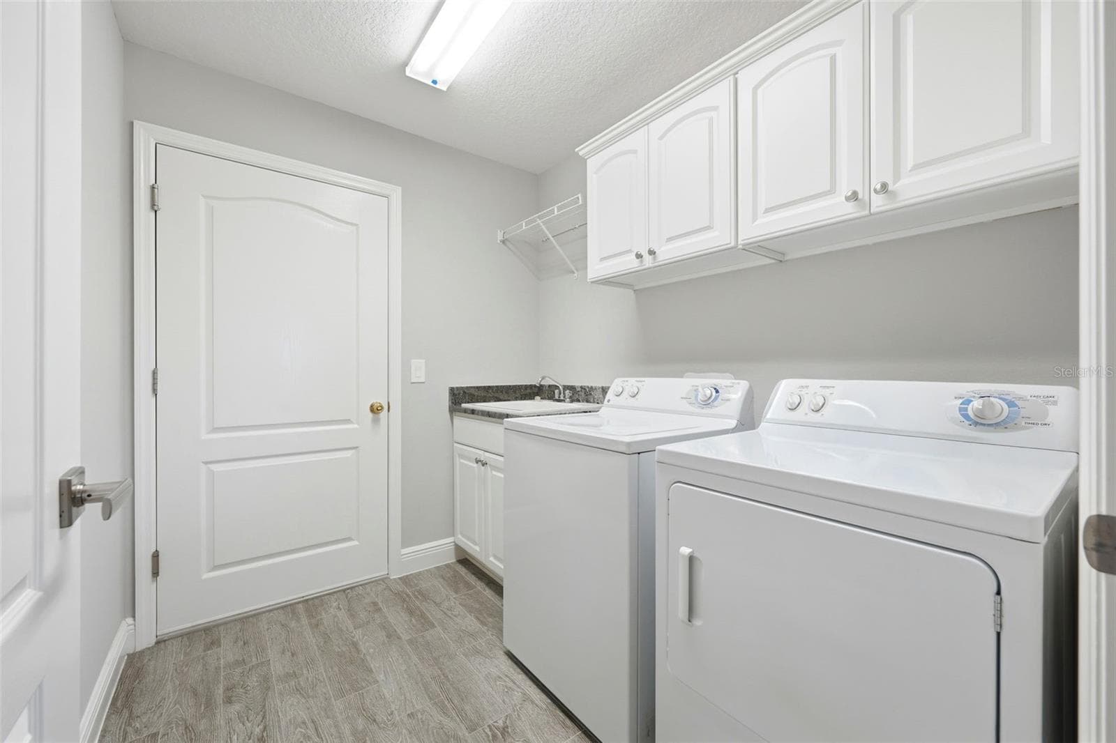 virtual staged laundry - 1166 BLOUNT AVE, THE VILLAGES