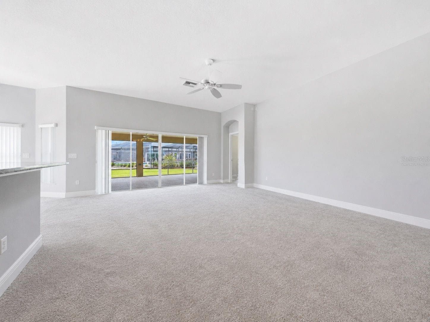 virtually staged  LR to patio - 1166 BLOUNT AVE, THE VILLAGES