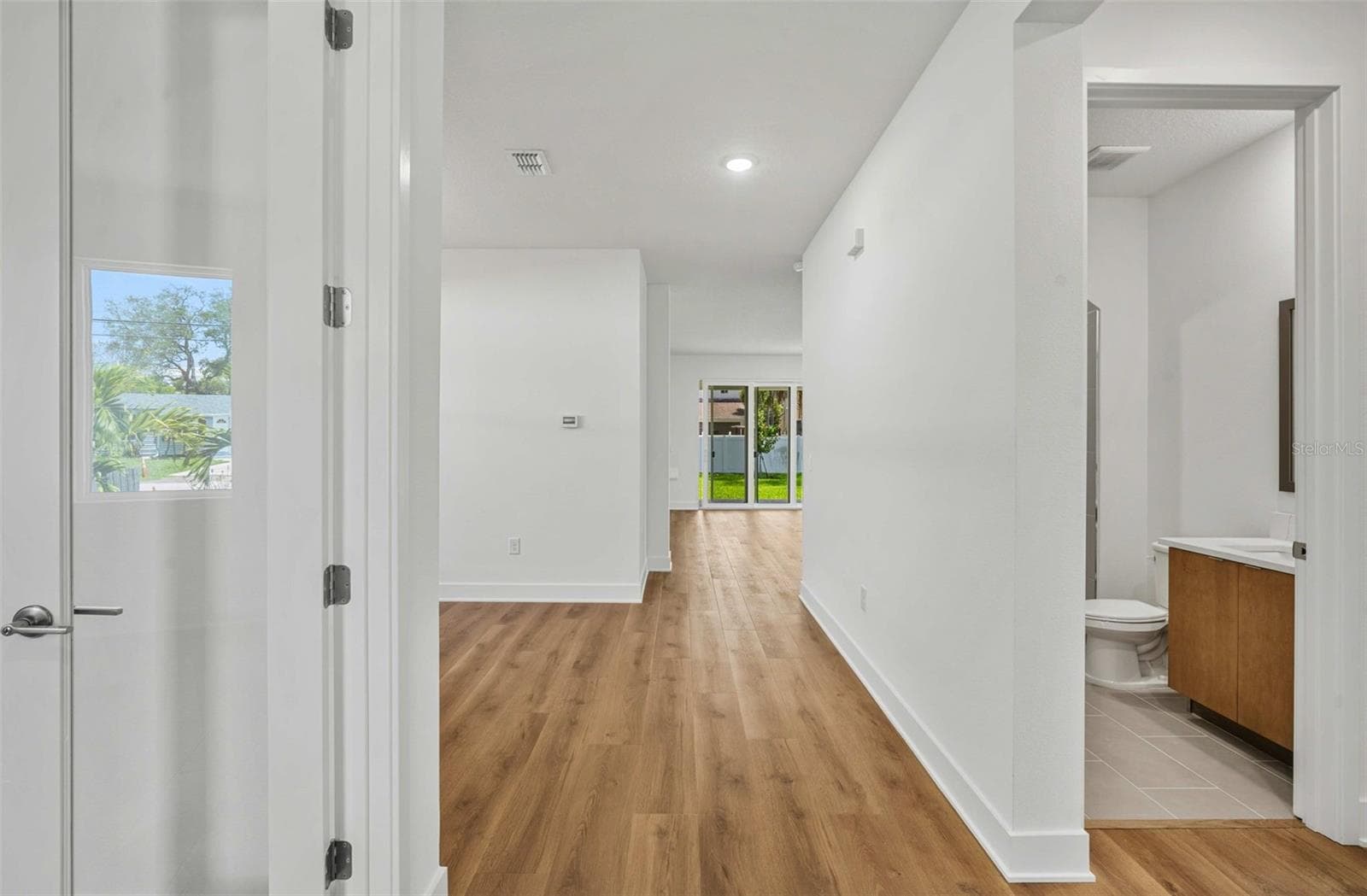 Front entry looking at den and first floor bathroom and bedroom - 3108 W BALLAST POINT BLVD, TAMPA