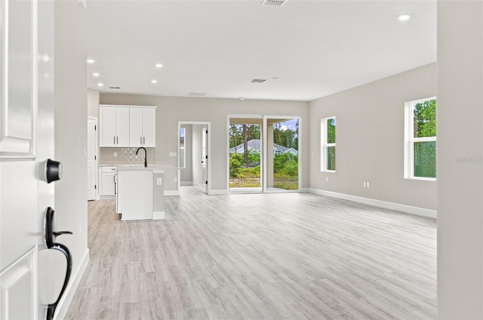 Light and bright interior with open floor plan and plenty of natural light. - 8211 ELKENBERRY AVE, NORTH PORT