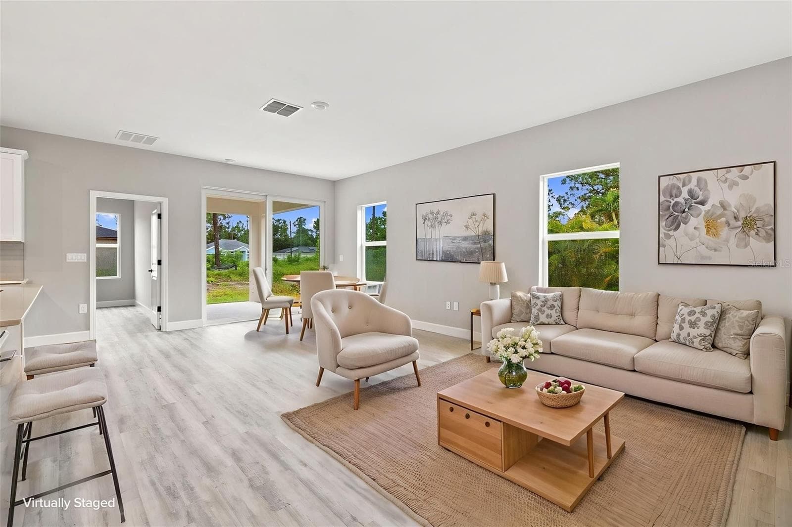 Spacious great room open to the kitchen is ideal for everyday living or entertaining. - 8211 ELKENBERRY AVE, NORTH PORT