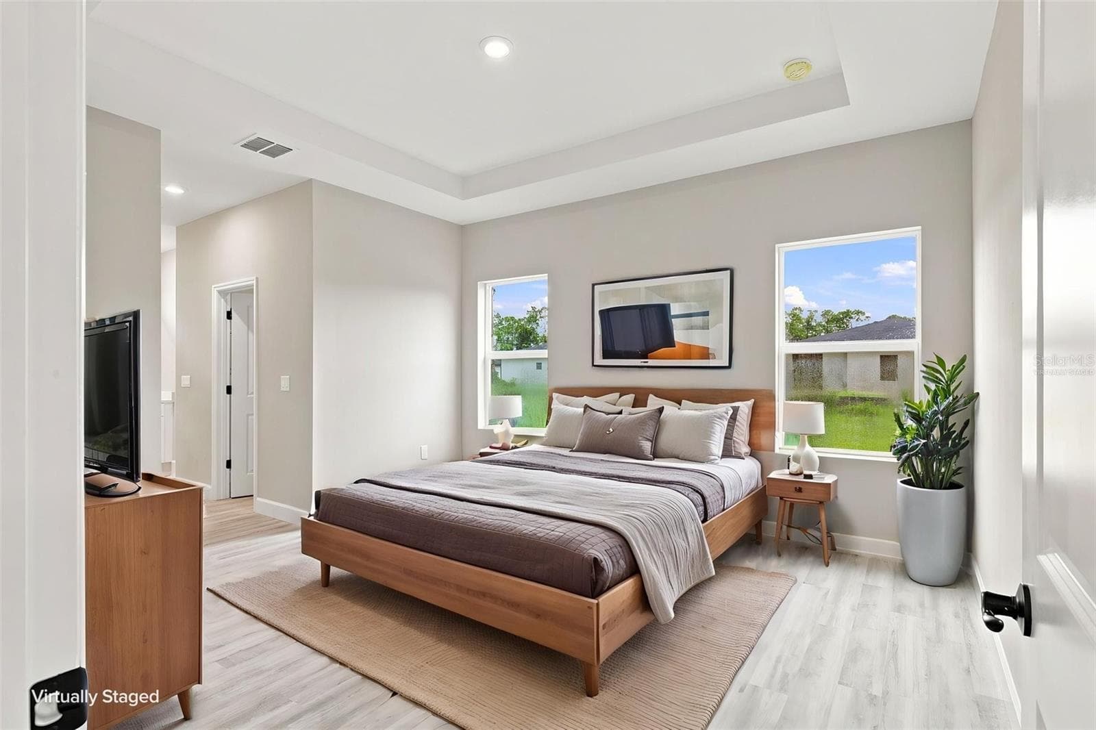 Primary Bedroom with private ensuite bath and 2 walk-in closets. (Virtually Staged) - 8211 ELKENBERRY AVE, NORTH PORT