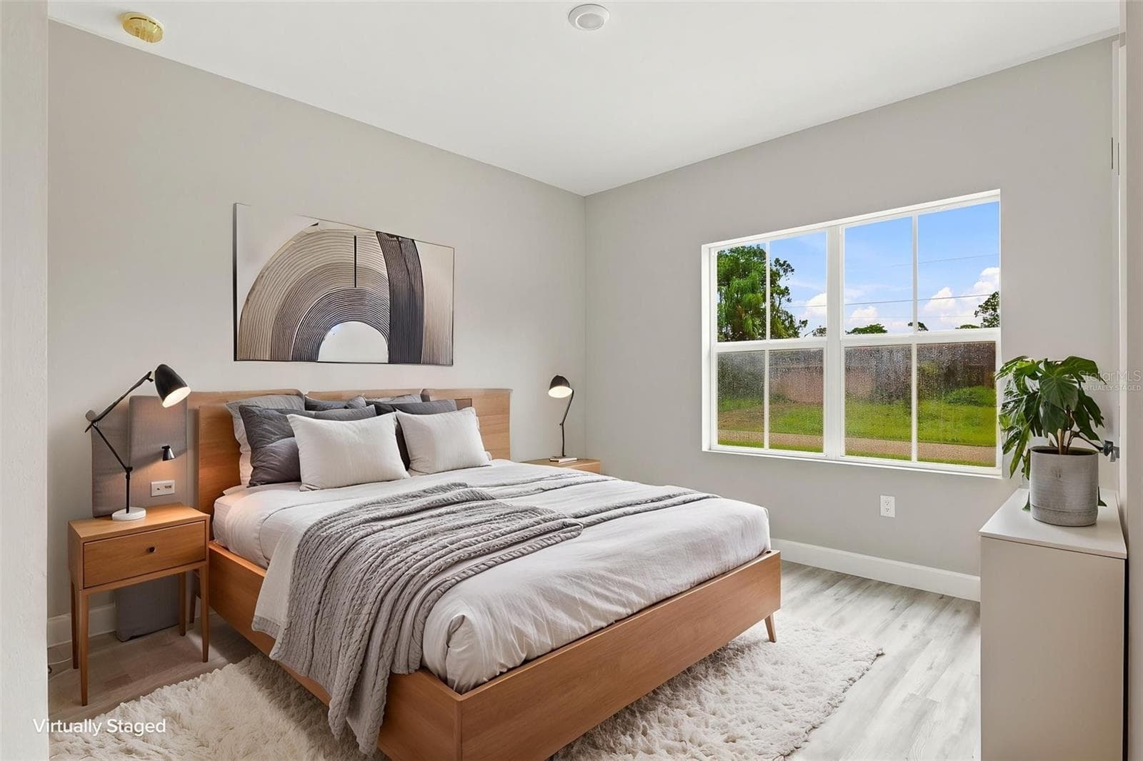 Bedroom 2 is located in the front of the house and can easily be used as a home office. (Virtually Staged) - 8211 ELKENBERRY AVE, NORTH PORT
