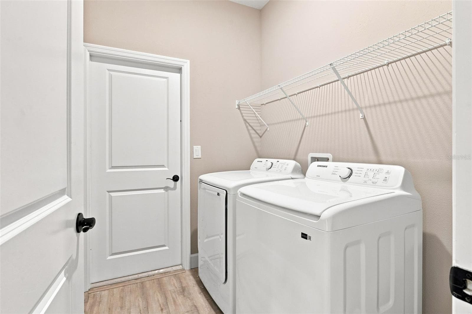 Large laundry room with full size washer and dryer. - 8211 ELKENBERRY AVE, NORTH PORT