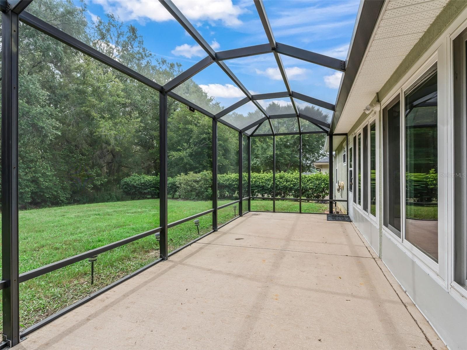 Screened lanai/ birdcage/porch - 17879 SE 125TH CIR, SUMMERFIELD