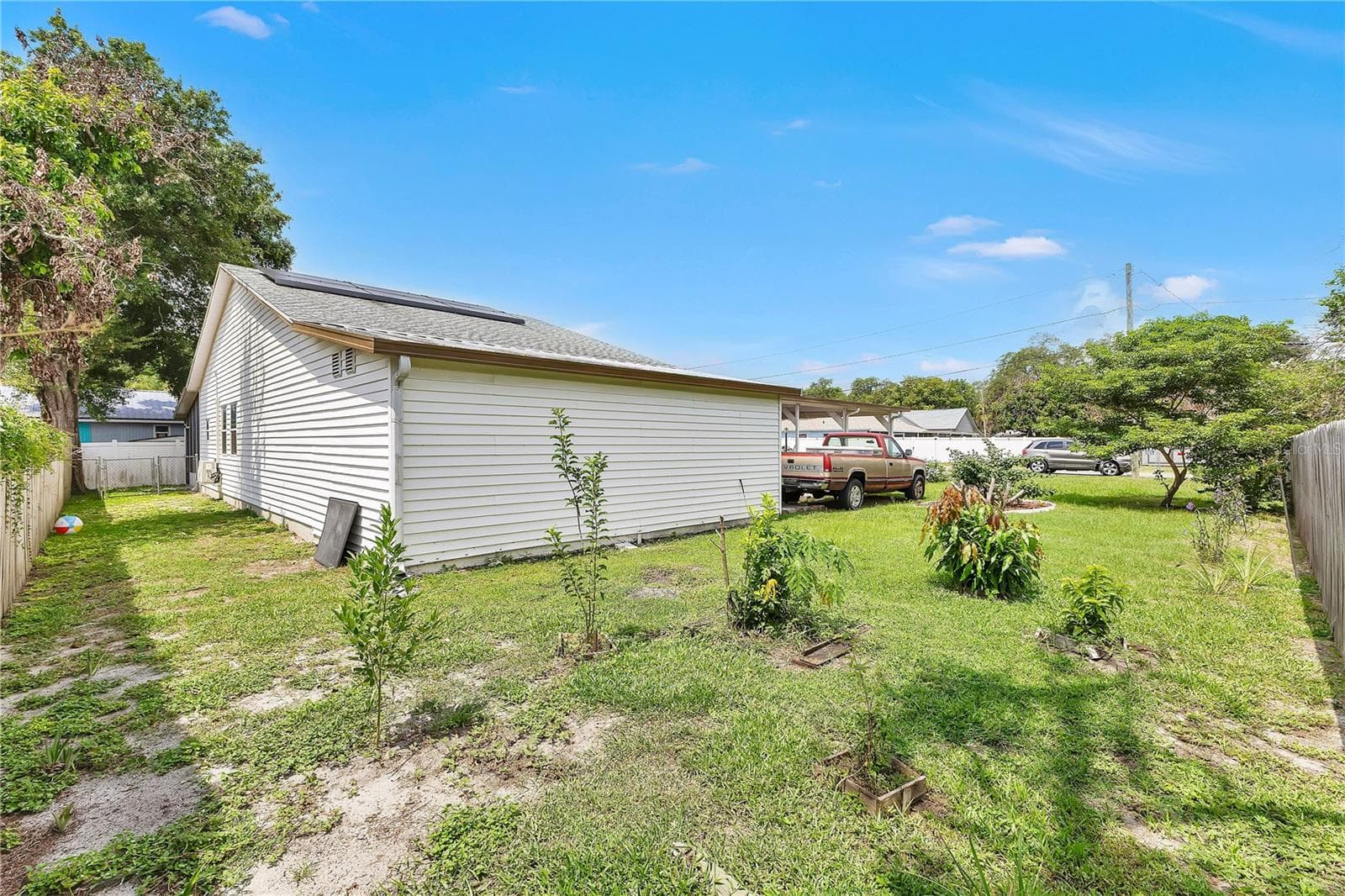 Private backyard offering endless possibilities for recreation and relaxation. - 205 TENNESSEE ST, HAINES CITY