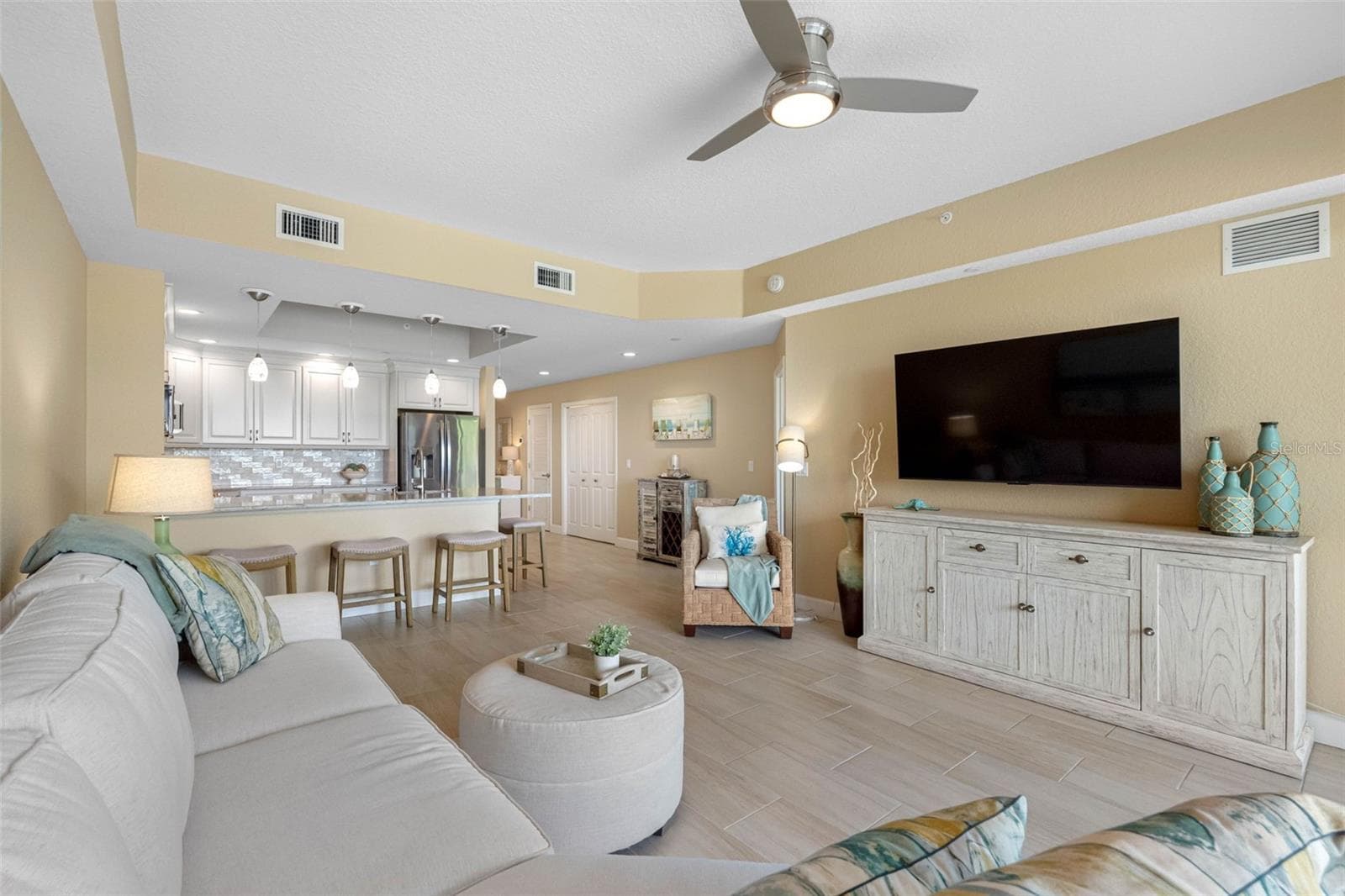 .. Photo without Rug to Show Wood Plank Tile Thru -Out all Living Areas & Bathrooms.. All 3 Bedrooms have New Luxury Vinyl Flooring. - 19519 GULF BLVD #202, INDIAN SHORES