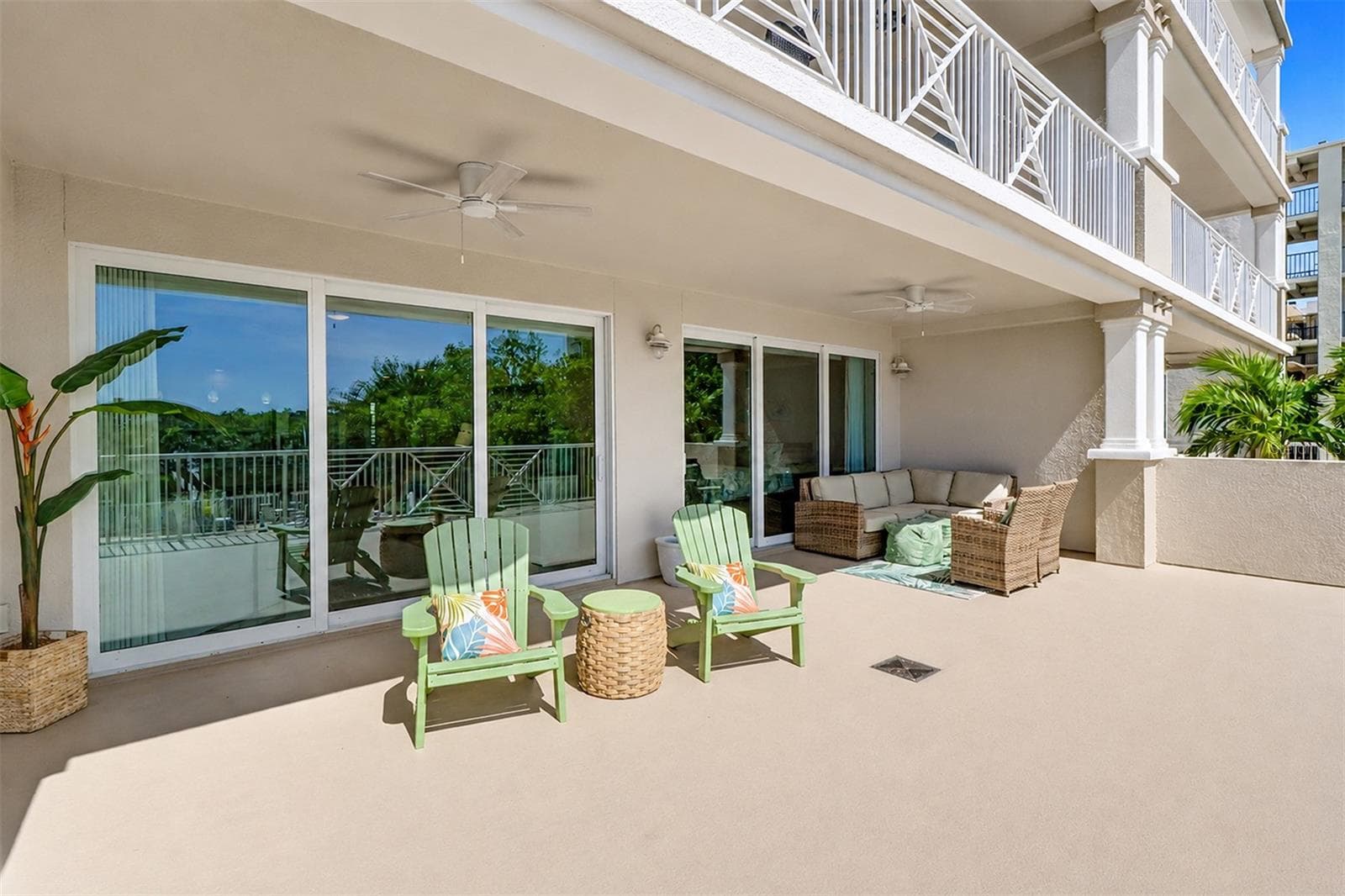 .. lARGE 30' X 20' TERRACE ... LIVING ROOM ON LEFT ..MASTER BEDROOM SUITE SLIDERS ON RIGHT IN PHOTO. THE LARGE TERRACE IS AKIN TO HAVING A PRIVATE BACK YARD.. PERFEC SPOT FOR A HAMMOCK TO RELAX IN. - 19519 GULF BLVD #202, INDIAN SHORES