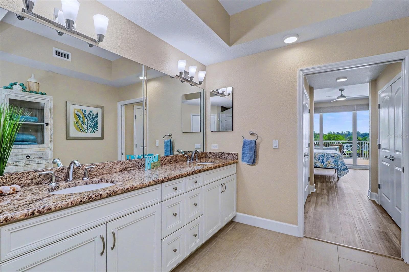 ..PRIMARY BATHROOM LOOKING OUT TOWARDS MASTER BEDROOM. - 19519 GULF BLVD #202, INDIAN SHORES