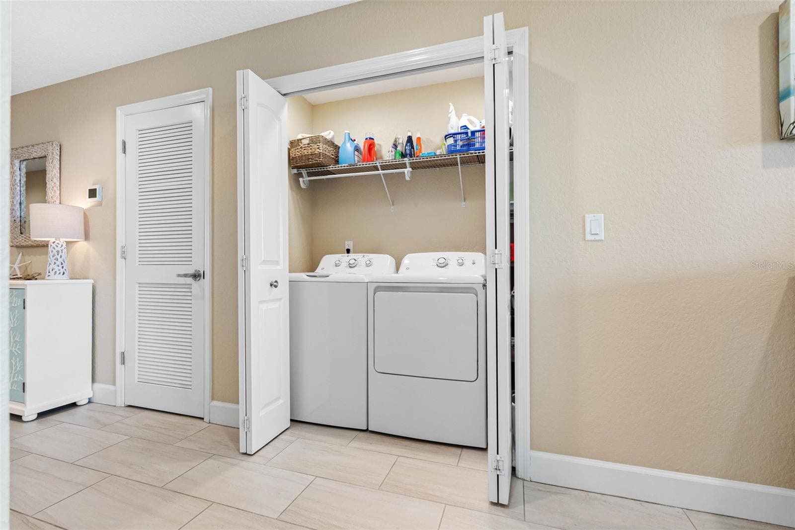 ... NEW WASHER & DRYER 2025.. With 1560 Sq FT - Condo has a well laid out Floorplan.. A/C System next to W & D behind Louvered Door. Plus a Tankless Whole House Water Heater. - 19519 GULF BLVD #202, INDIAN SHORES