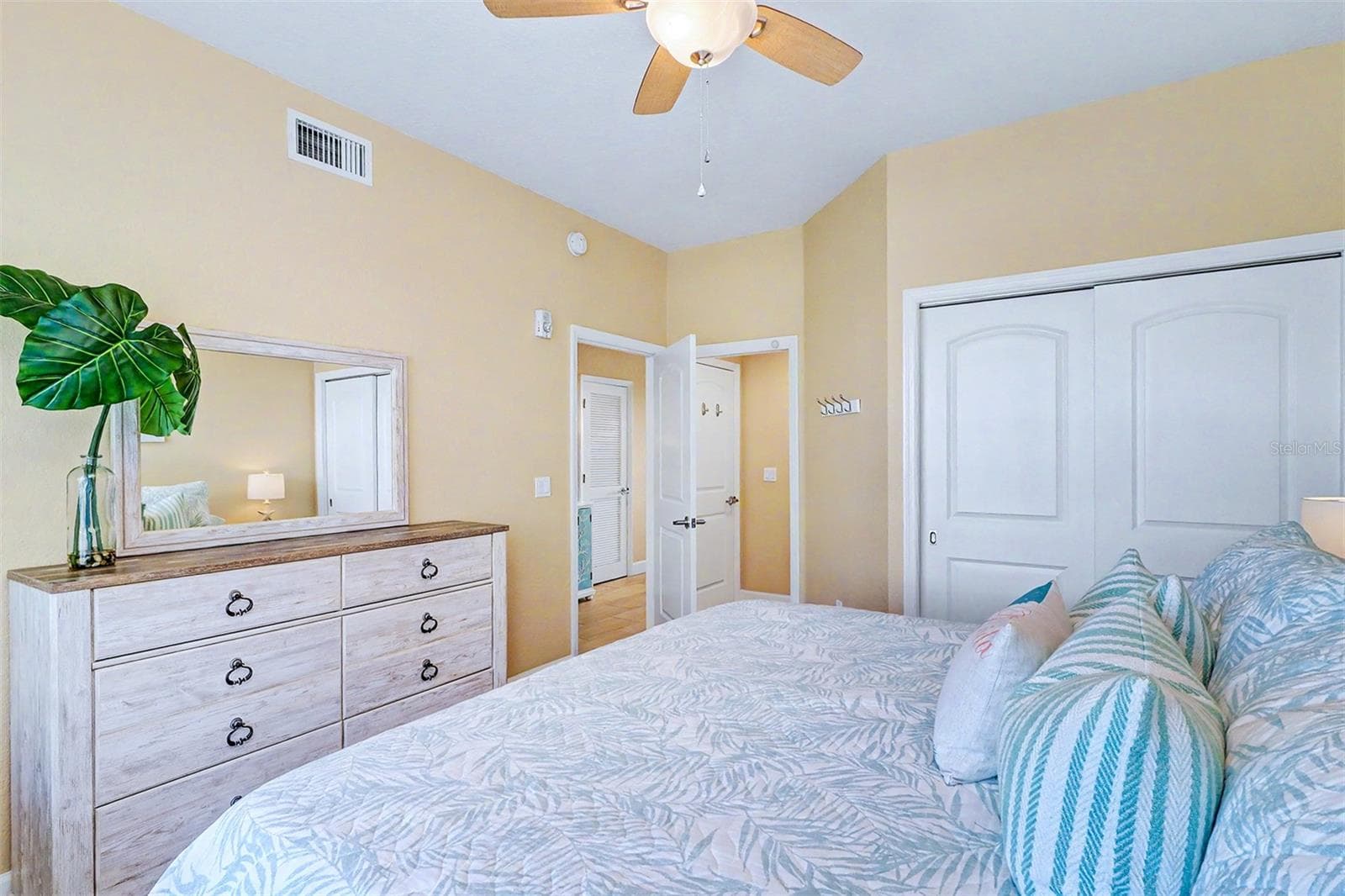 ... GUEST BEDROOM # ONE... Looking out towards Hallway and Guest Bathroom entrance thru pocket door. This allows this bedroom to be En -Suite if needed.. - 19519 GULF BLVD #202, INDIAN SHORES